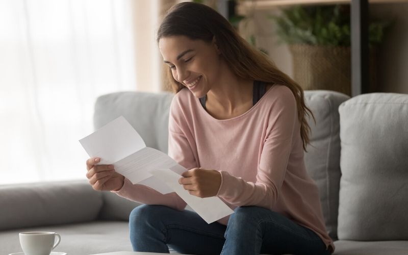 Young business woman reading an offer letter