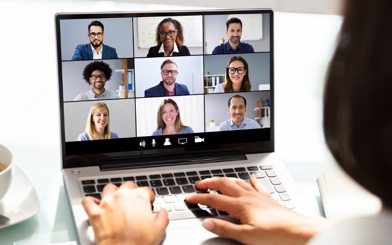 Woman working from home on a group video conference