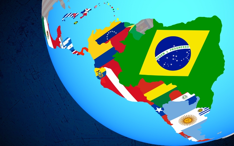 Global Graphic showing latin american country flags in the shape of the continents on a map on a navy blue background