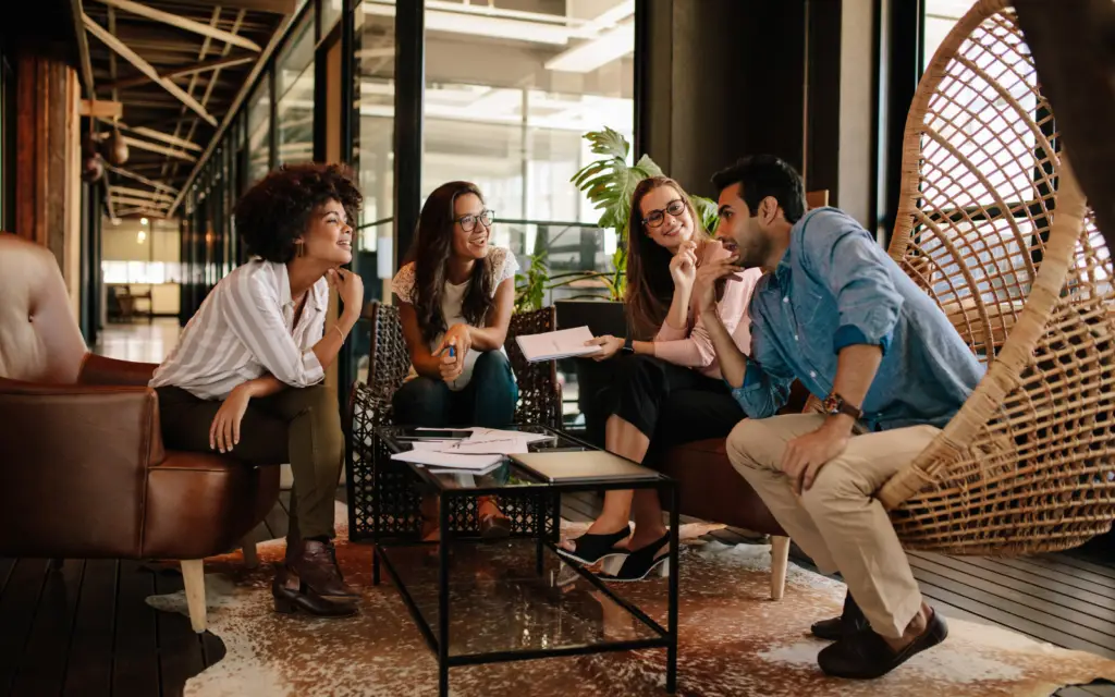 interns conversing in a lounge area